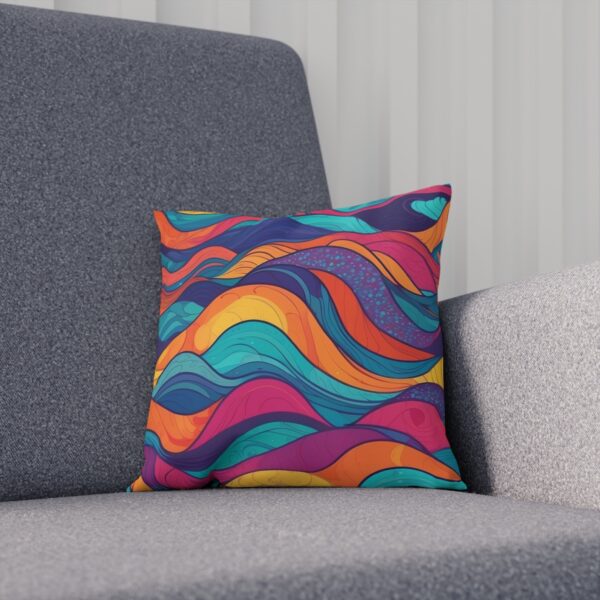 Cushion with swirling colors in wave design on gray chair