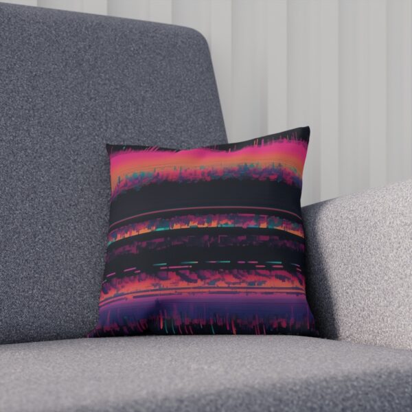 Cushion with abstract digital noise design on gray chair