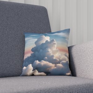 Plush cushion with a dynamic cloud and sunset print on a gray chair