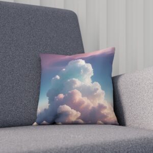 Cushion with pastel cloud design on gray armchair