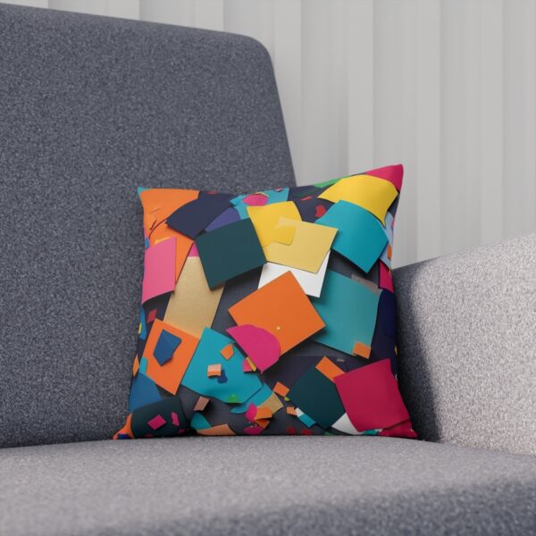 Abstract color-block cushion on gray chair