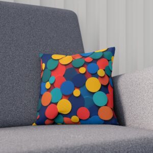 Colorful round confetti cushion on a contemporary gray chair