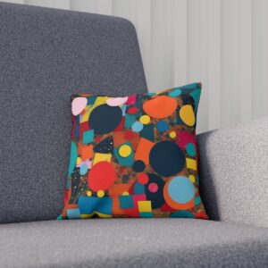 Cushion with colorful circles and squares on gray chair