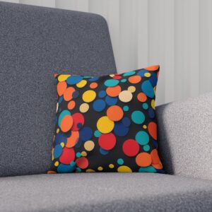 Colorful polka-dot cushion on a gray sofa