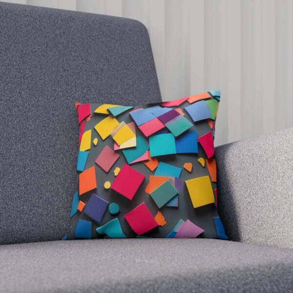 Colorful geometric-pattern cushion on a gray chair