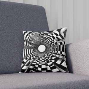 Black and white op art cushion with a dynamic swirl pattern on a grey couch.