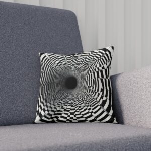 Optical illusion cushion with black and white geometric pattern on sofa