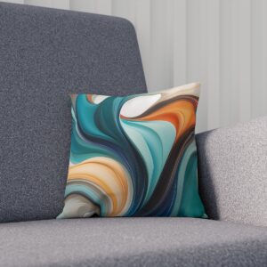 Decorative cushion with flowing teal, gold, and cream abstract design on a sofa.