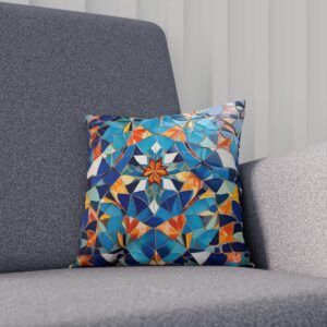 Cushion with colorful geometric mosaic design on a grey sofa.