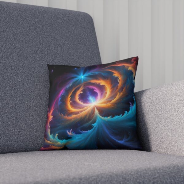 Cushion with cosmic swirl pattern in vibrant blue and orange on a sofa.