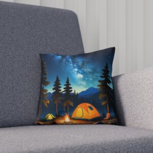 Cushion with a campsite under a starry sky among tall trees on a sofa.