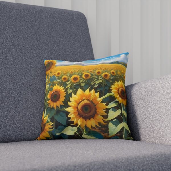 Cushion with bright sunflower field design against a blue sky on a couch.