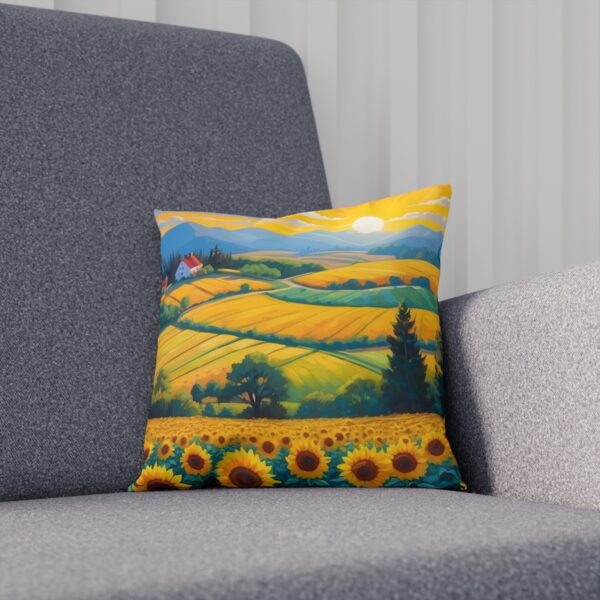 Cushion with a vibrant sunflower field and rolling hills design on a couch.