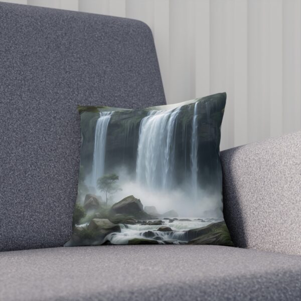 Cushion with a misty waterfall scene on a grey couch