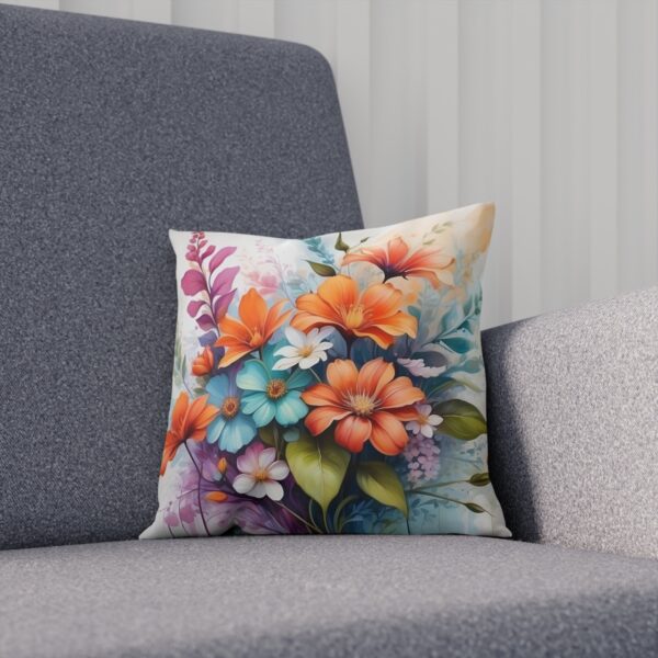 Cushion featuring a bouquet of pastel flowers on a muted background on sofa