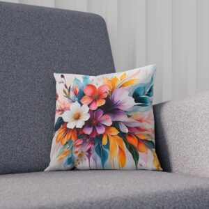 Artistic floral cushion with colorful blooms on soft background on sofa