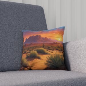 Sunset over desert landscape cushion, with mesas and brush, on a gray armchair.