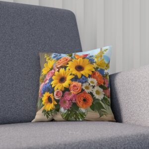 Cushion with vivid summer flowers and lush greenery on sofa