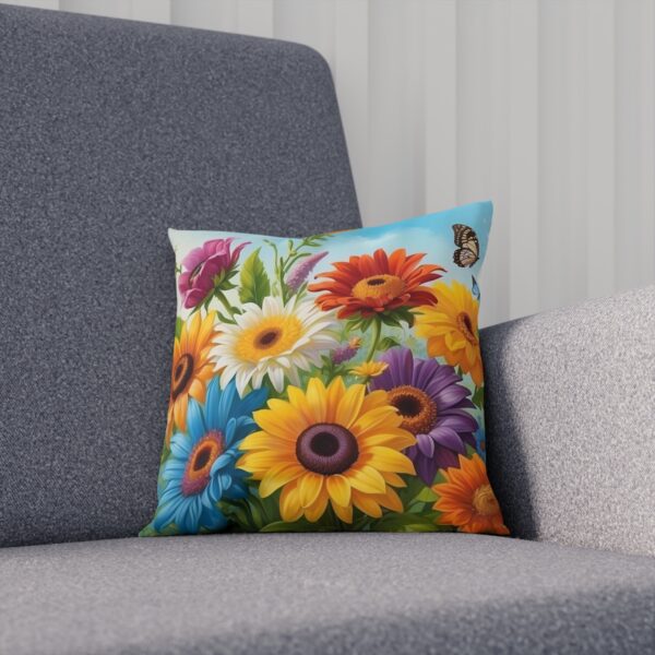 Colorful floral cushion with a butterfly on a grey sofa