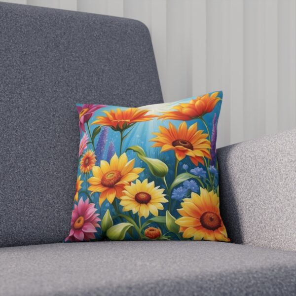 Colorful summer floral cushion on grey sofa