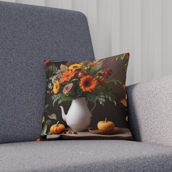 Autumn bouquet and pumpkins print on cushion on grey sofa