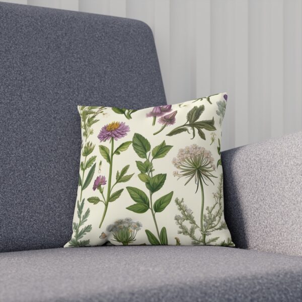 Decorative cushion with a variety of illustrated herbs and flowers on sofa