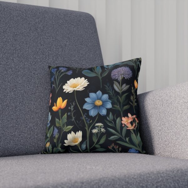 Decorative cushion with various flowers on a dark background