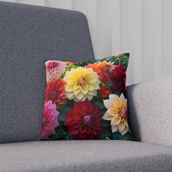 Floral cushion with vibrant multi-colored dahlia blooms