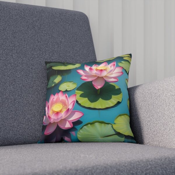 Cushion with pink lotus blossoms and lily pads on a pond