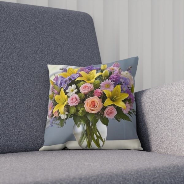 Cushion with a bouquet of spring flowers in a clear vase