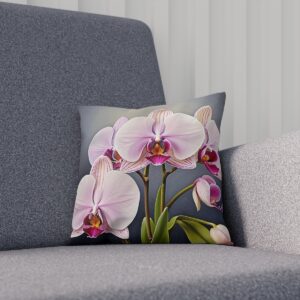 White and pink orchids on a cushion with a gray background