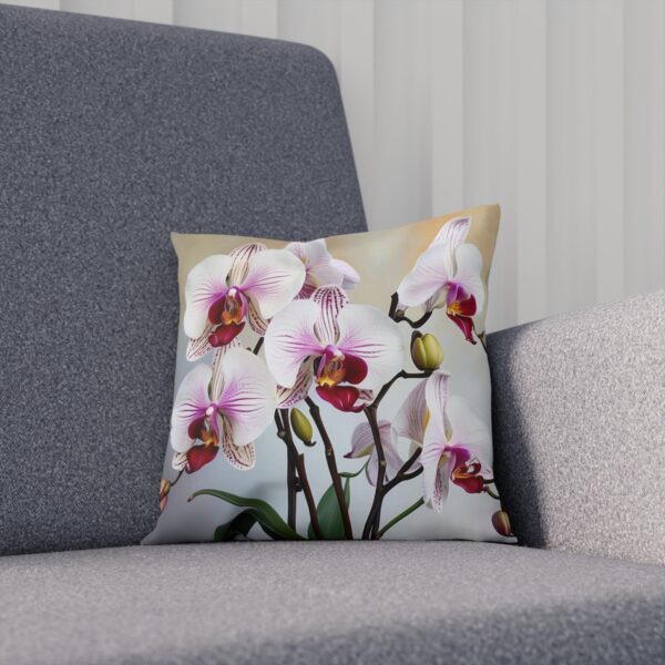 Cushion featuring white and pink orchids on a light background