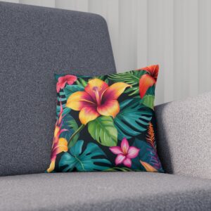 Colorful tropical flower and leaf pattern cushion on sofa