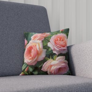 Cushion with lush pink rose blossoms and green foliage