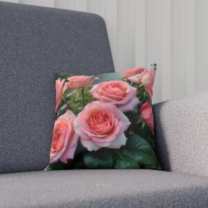 Blush pink roses on cushion with green leafy background