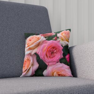 Pink and peach roses cushion on gray sofa