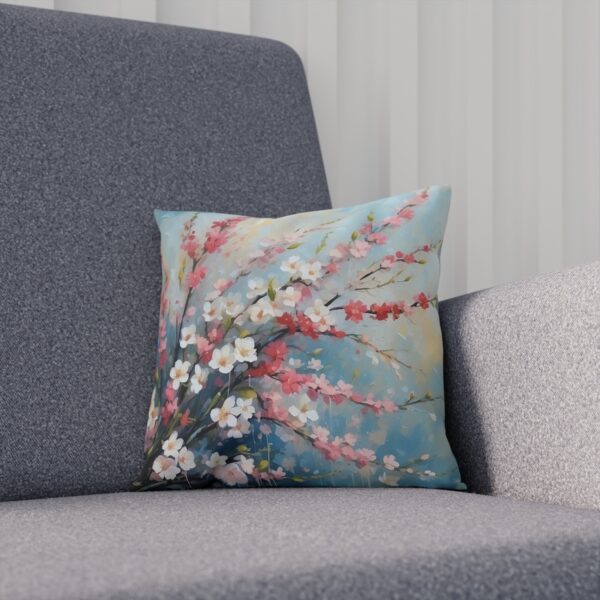 Cushion with pastel cherry blossom design on sofa