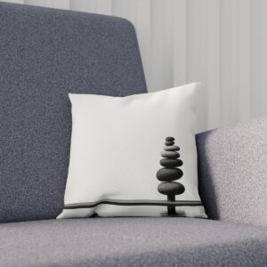 Cushion with stacked stones print on a gray sofa Title: Stacked-Stones-Print-Cushion