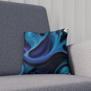 Cushion with flowing blue ink design on a gray textured chair