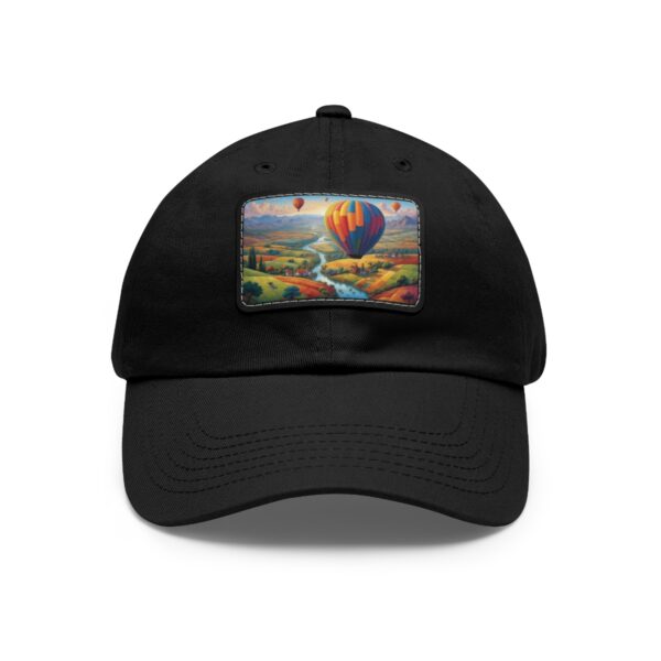 Dad Hat with rectangular patch featuring a vibrant hot air balloon floating over a river and scenic landscape