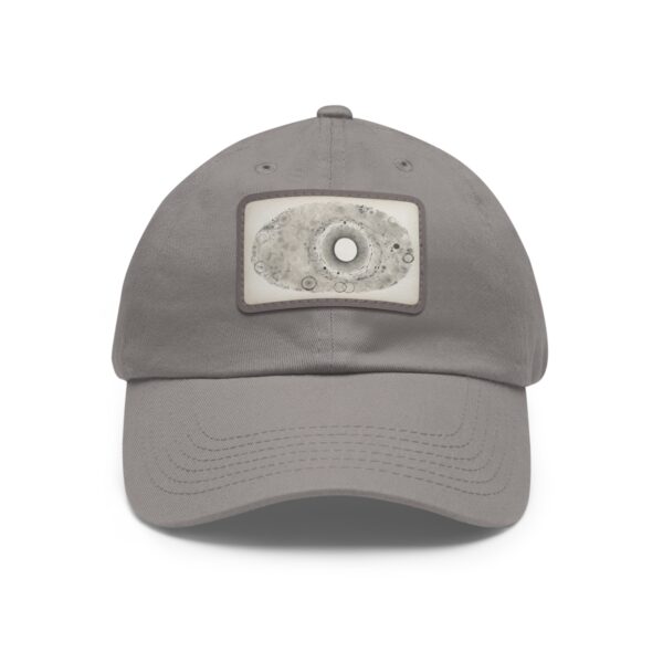 Dad Hat with stitched patch featuring a minimalist circular design in soft, neutral tones.