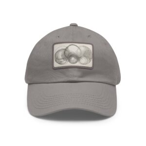 Dad Hat with stitched patch featuring a subtle abstract design of overlapping circles in soft, neutral tones.