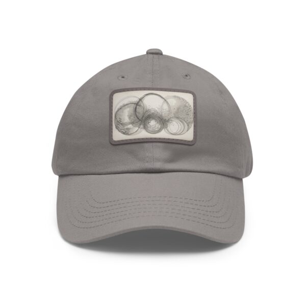 Dad Hat with stitched patch featuring a subtle abstract design of overlapping circles in soft, neutral tones.