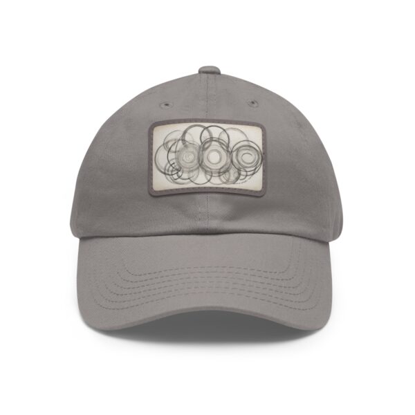 Dad Hat with stitched patch featuring an abstract geometric design of overlapping circles in neutral tones.