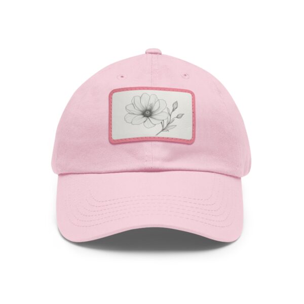 Dad Hat with stitched patch featuring a minimalist line drawing of a blooming flower with leaves.