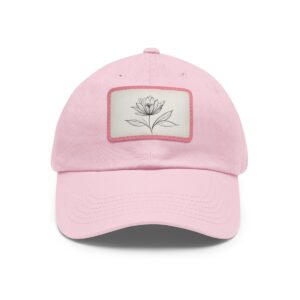 Dad Hat with stitched patch featuring a minimalist line drawing of a blooming flower.