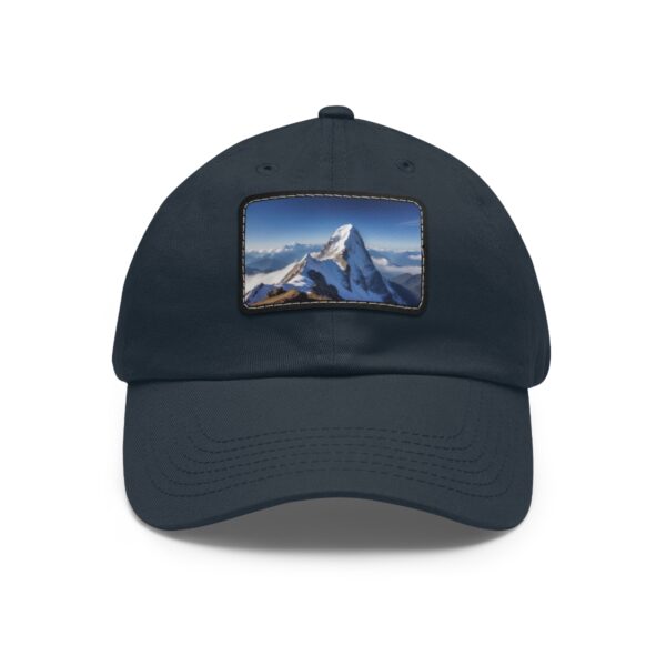 Navy dad hat with a snow-capped mountain view on a leather patch.