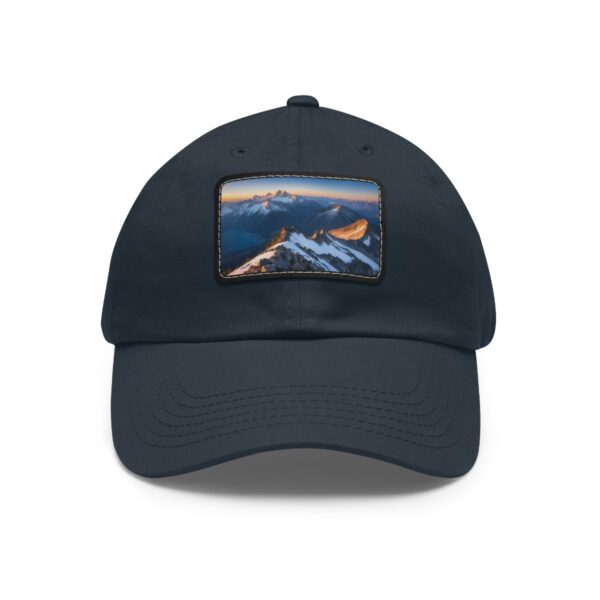 Navy dad hat with a twilight mountain range on a leather patch.