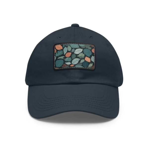 Dad Hat with stitched patch featuring a dense leaf pattern in green, blue, and orange shades.