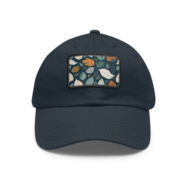 Dad Hat with stitched patch featuring a colorful leaf pattern in shades of green, white, and orange.